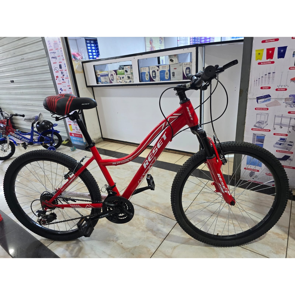 Side view of Reset Mountain Bike Size 24 in red
