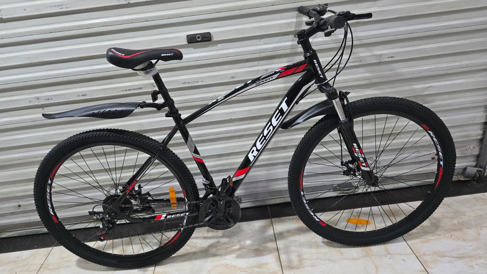 Reset Size 29 Mountain Bike 21 Speed 3×7 Gears with Disc Brakes & Front Suspension – Black