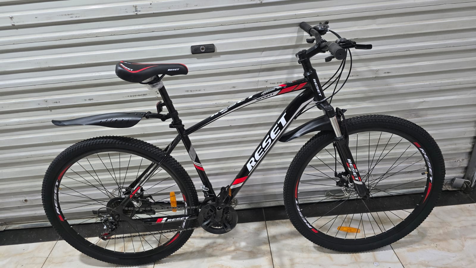 Reset Size 29 Mountain Bike 21 Speed 3×7 Gears with Disc Brakes & Front Suspension – Black